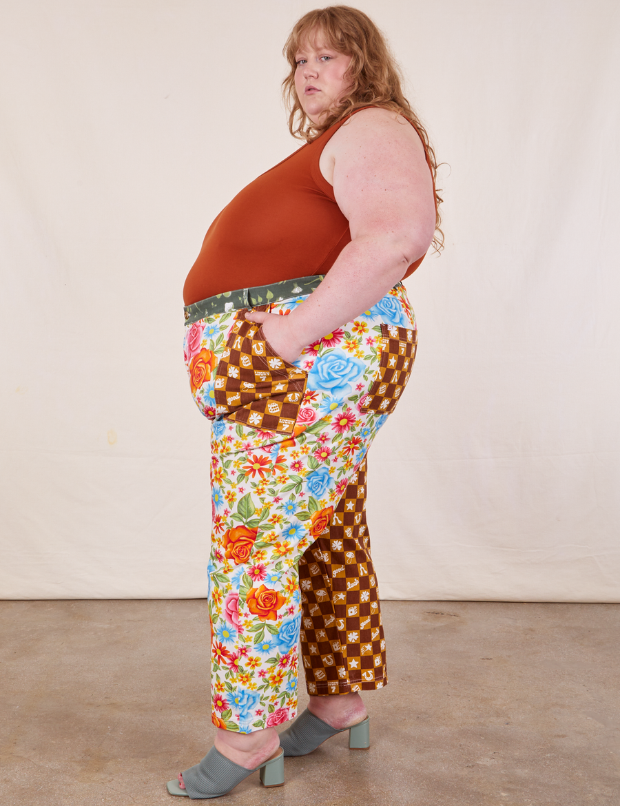 Side view of Mismatched Print Work Pants and burnt terracotta Tank Top worn by Catie