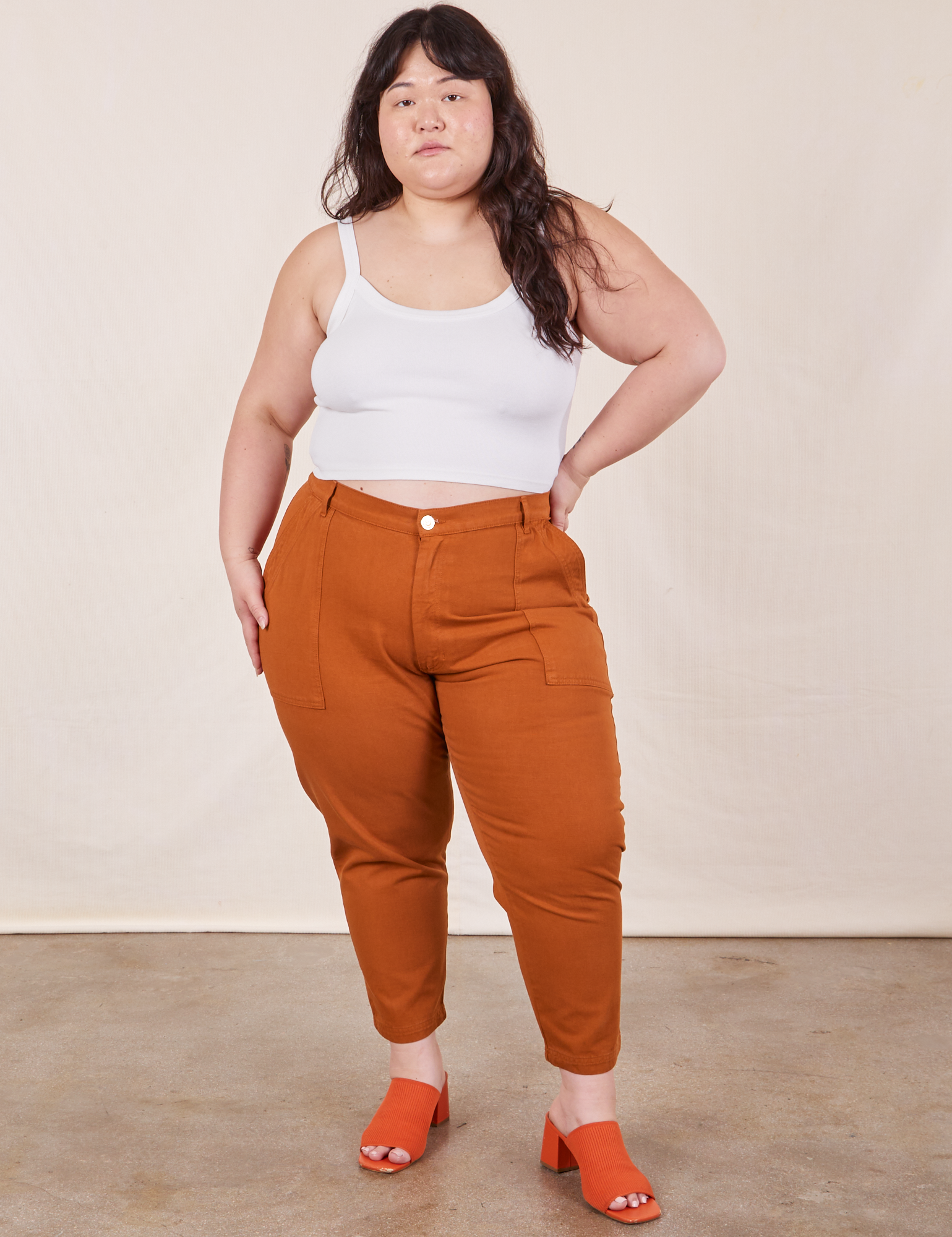 Ashley is 5&#39;7&quot; and wearing 1XL Petite Pencil Pants in Burnt Terracotta paired with vintage off-white Cropped Cami