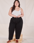 Ashley is 5'7" and wearing 1XL Petite Heritage Trousers in Basic Black