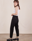 Side view of Petite Pencil Pants in Basic Black and vintage off-white Cropped Tank Top on Hana