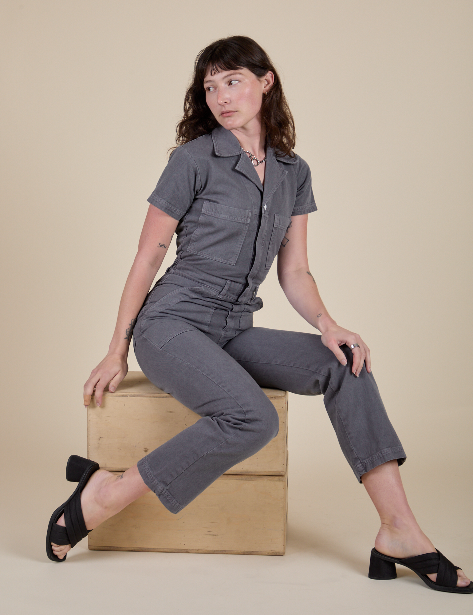 Alex is wearing Short Sleeve Jumpsuit in Washed Grey