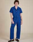 Quinn is 6'3" and wearing L Short Sleeve Jumpsuit in Royal Blue