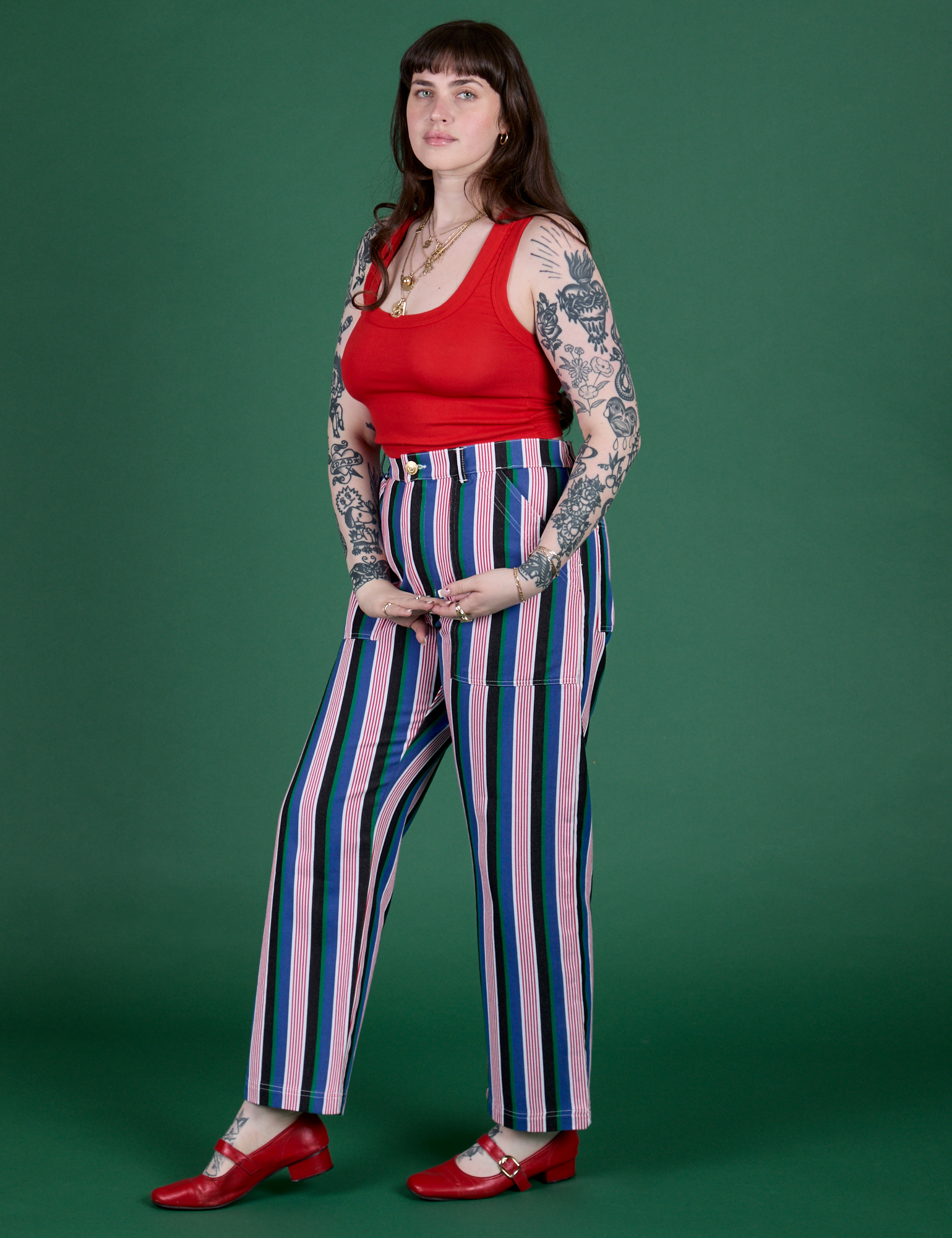 Angled front view of  Work Pants in Pacific Stripe and mustang red Cropped Tank on Sydney