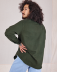 Angled back view of Flannel Overshirt in Swamp Green on Jesse