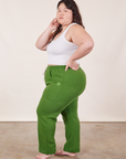 Side view of Cropped Rolled Cuff Sweatpants in Lawn Green and vintage off-white Cropped Tank Top on Ashley