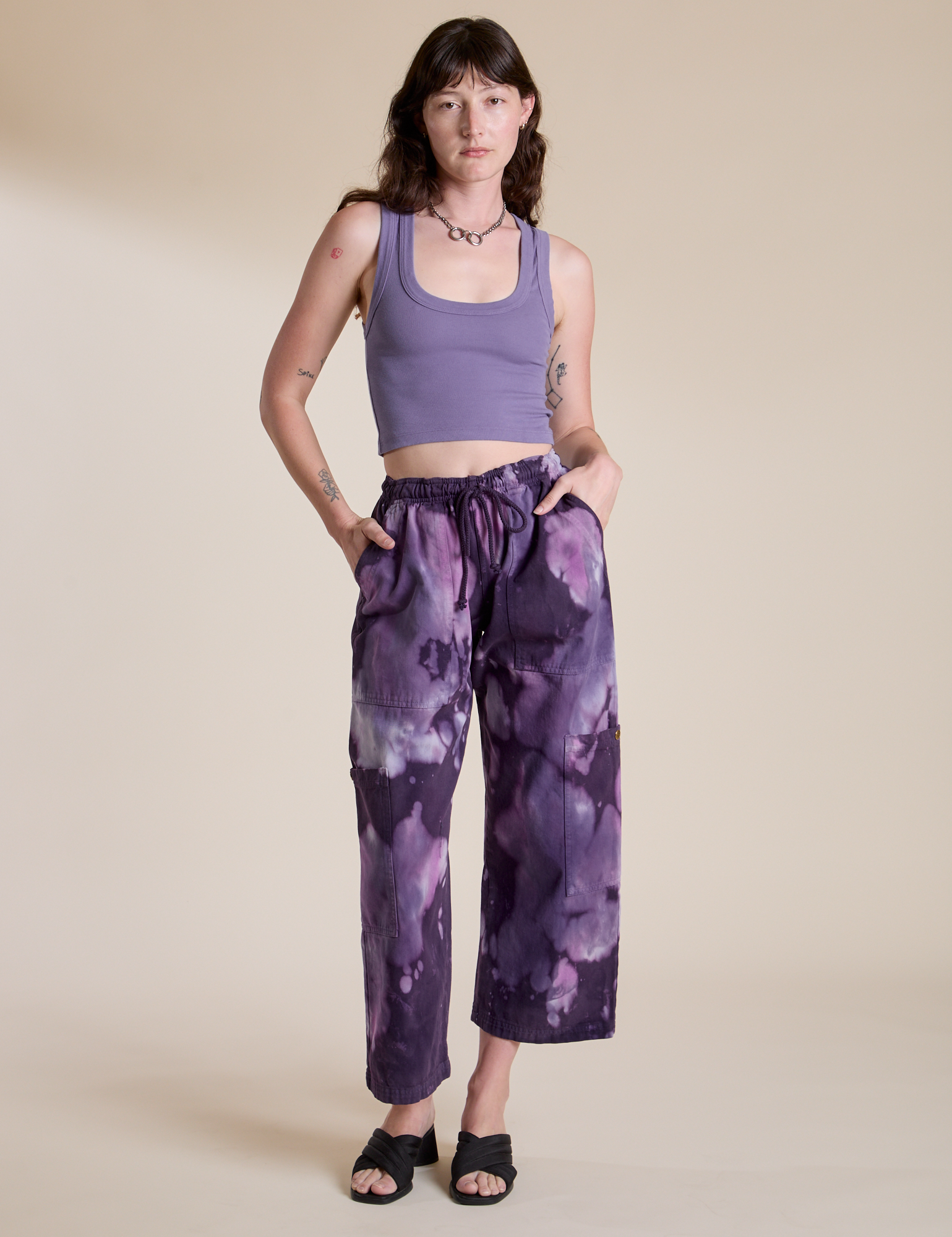 Alex is wearing Magic Waters Drop Pocket Pants in Dark Lavender and faded grape Cropped Tank