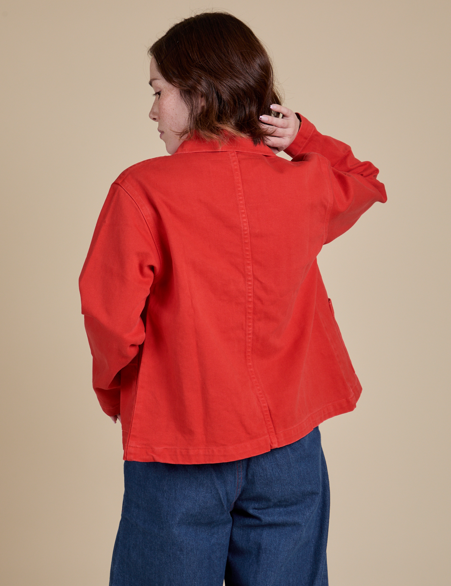 Denim Work Jacket in Mustang Red back view on Hana