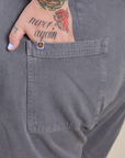 Close up of Sam's hand in the back pocket of Work Pants in Washed Grey