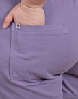 Close up of Ashley's hand in the back pocket of Classic Work Shorts in Faded Grape