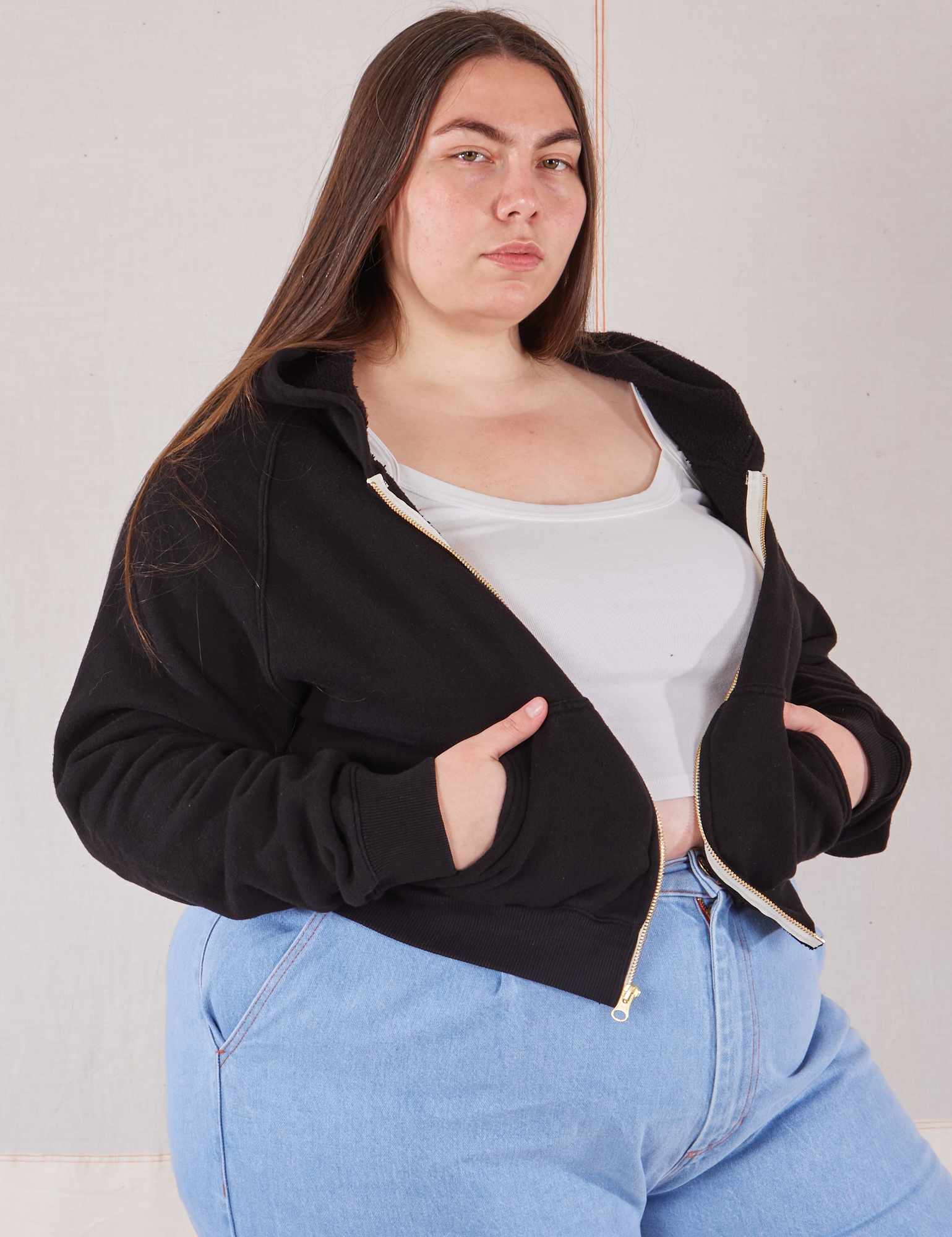 Cropped Zip Hoodie in Basic Black angled front view of Cropped Zip Hoodie in Basic Black on Marielena