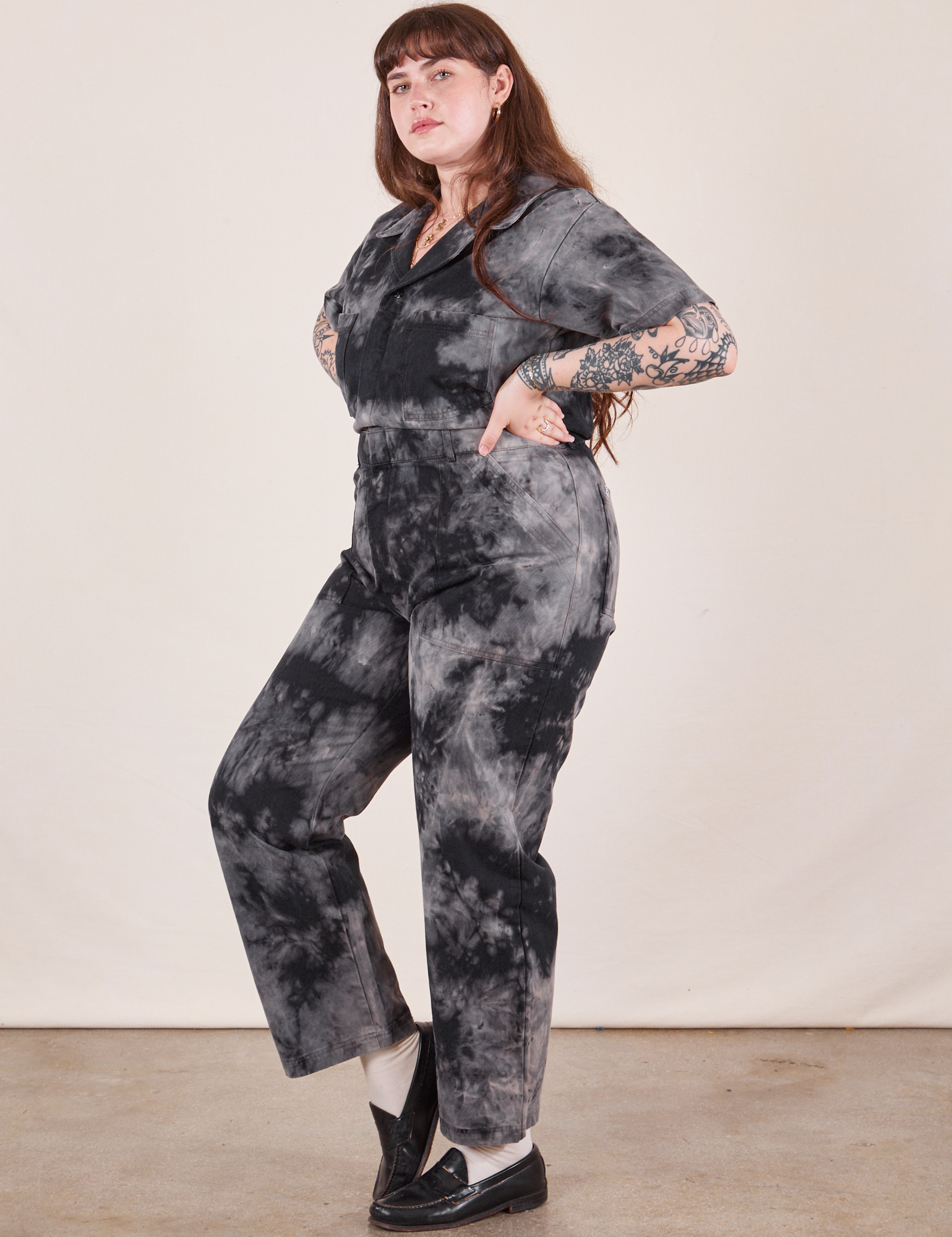 Side view of Short Sleeve Jumpsuit in Black Magic Waters worn by Sydney
