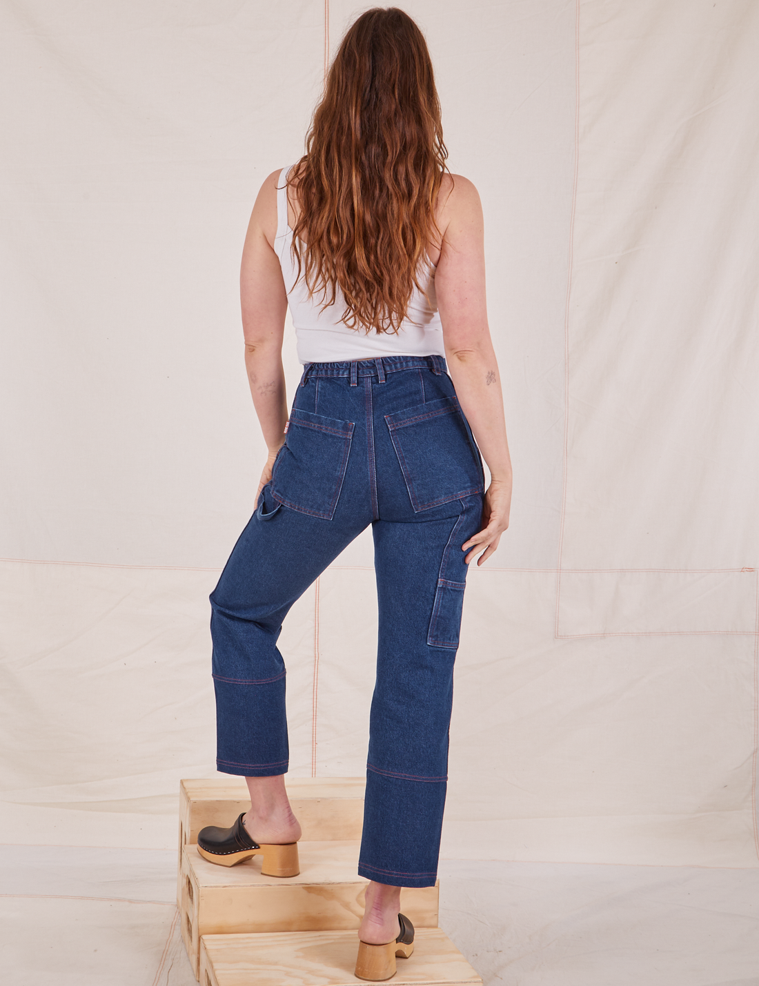 Back view of Carpenter Jeans in Dark Wash worn by Allison