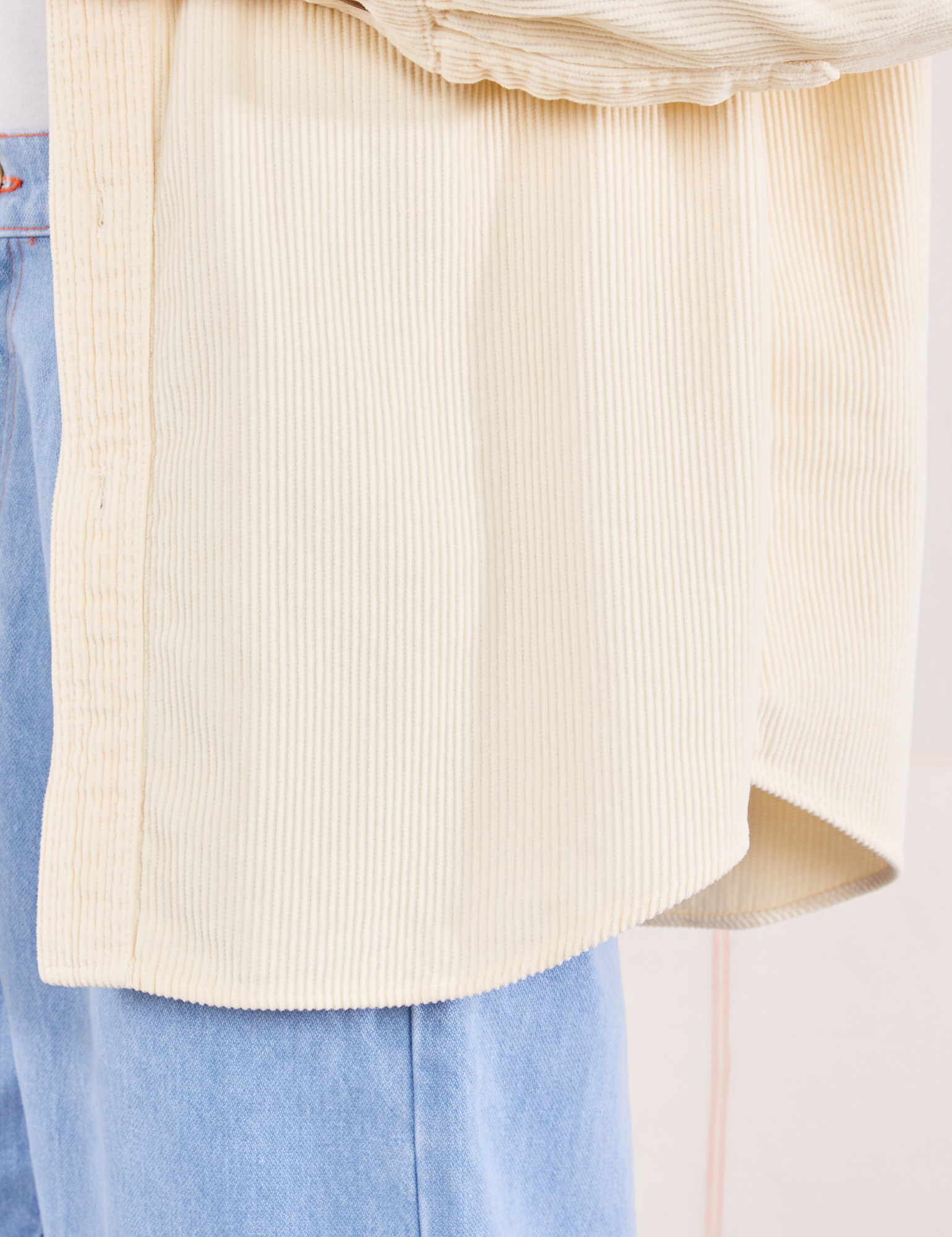 Corduroy Overshirt in Vintage Off-White hem close up on Jesse