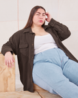 Marielena is wearing Flannel Overshirt in Espresso Brown, vintage off-white Cropped Tank Top and light wash Trouser Jeans