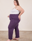 Side view of Cropped Rolled Cuff Sweatpants in Nebula Purple and vintage off-white Cami on Marielena