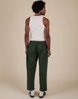 Back view of Heavyweight Trousers in Swamp Green and Tank Top in Vintage Tee Off-White on Jerrod
