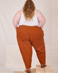 Back view of Heavyweight Trousers in Burnt Terracotta worn by Catie
