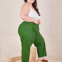 Side view of Heavyweight Trousers in Lawn Green and vintage off-white Cropped Cami worn by Ashley
