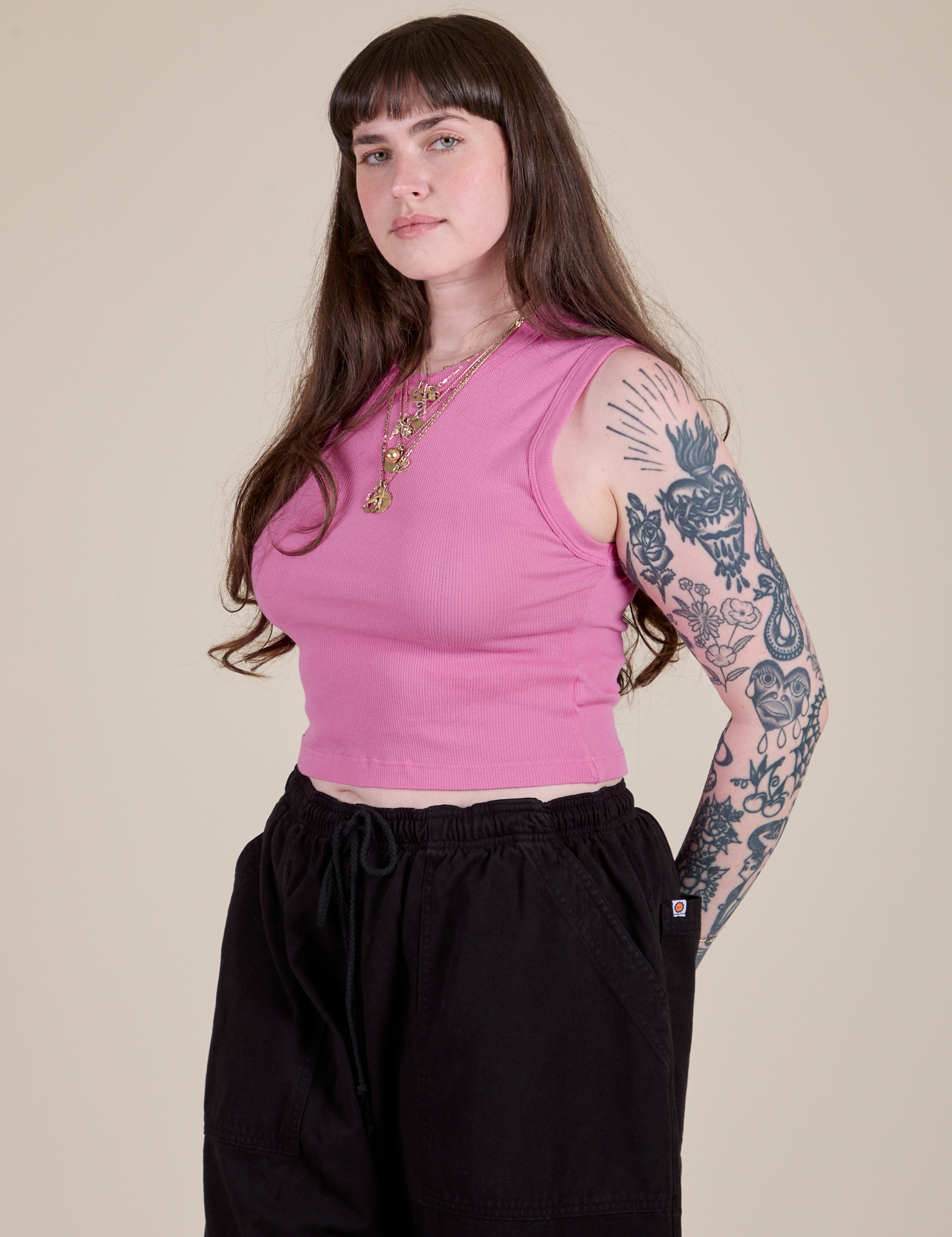 Angled front view of Muscle Tee in Bubblegum Pink on Sydney