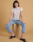 Alex is wearing Organic Vintage Tee in Vintage Off White and light wash Carpenter Jeans