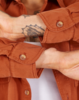 Sleeve cuff close up of Oversize Overshirt in Burnt Terracotta worn by Jesse
