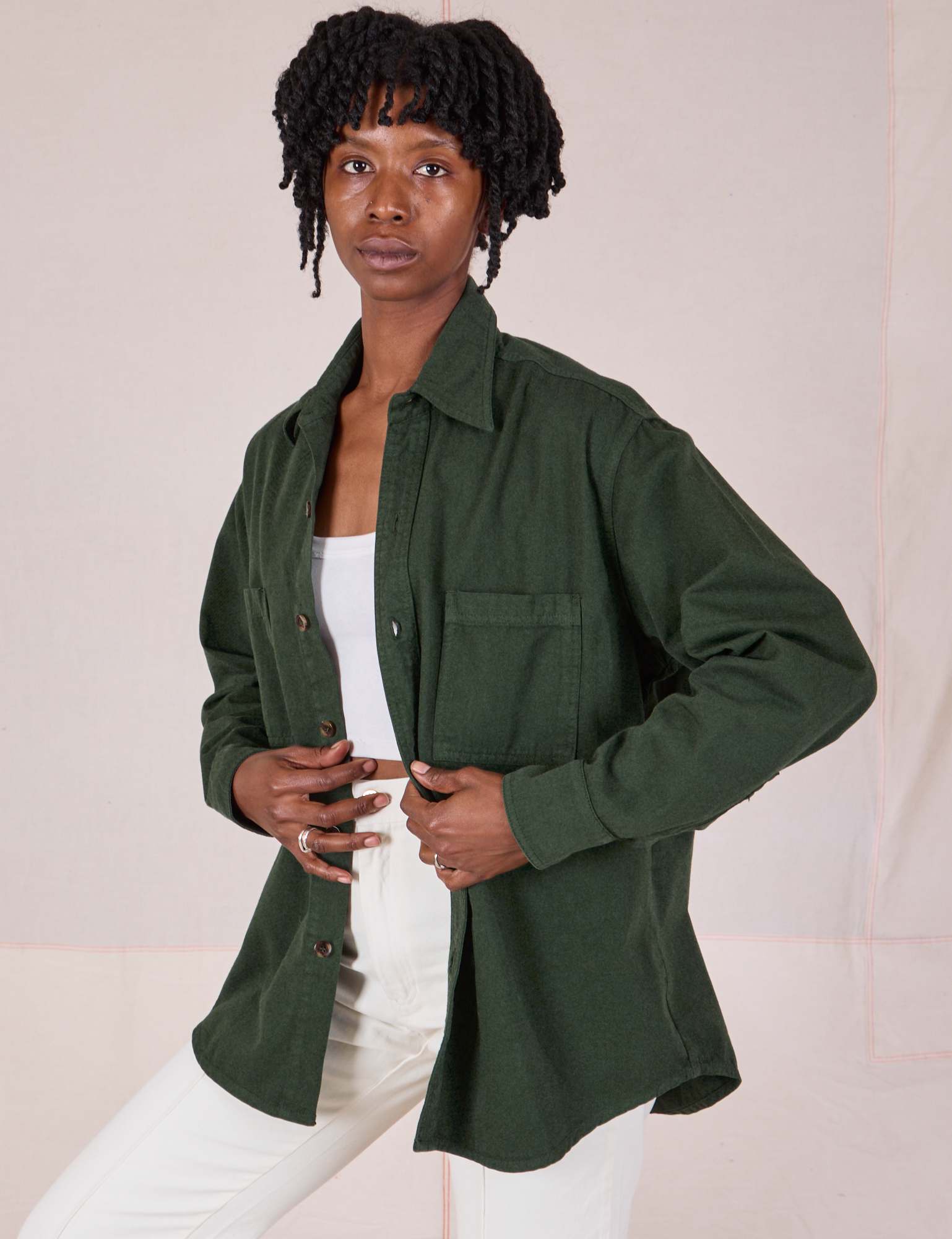 Angled front view of Twill Overshirt in Swamp Green on Cheyann