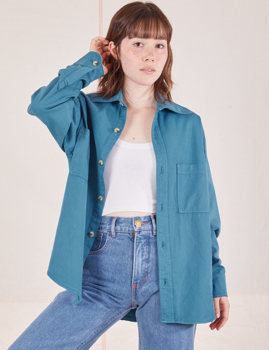 Hana is wearing size P Oversize Overshirt in Marine Blue with a vintage off-white Cropped Tank Top underneath