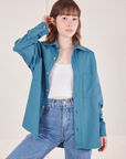 Hana is wearing size P Oversize Overshirt in Marine Blue with a vintage off-white Cropped Tank Top underneath
