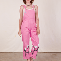 Alex is wearing California Poppy Overalls in Bubblegum Pink and vintage off-white Tank Top