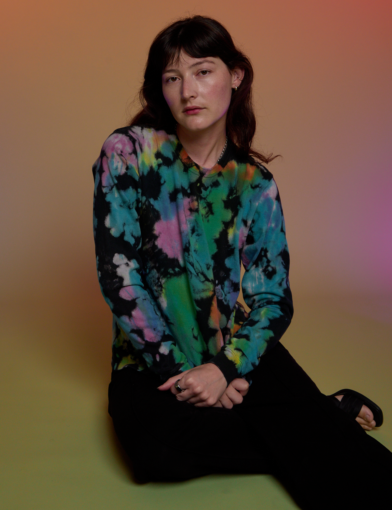 Alex is wearing Magic Waters Long Sleeve Burly Tee in Rainbow