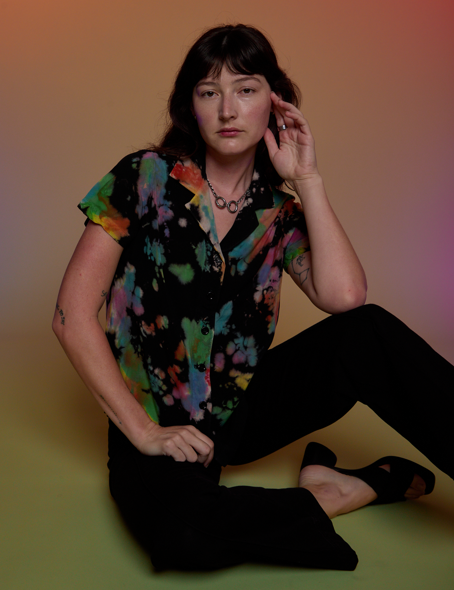 Alex is wearing Pantry Button-Up in Rainbow Magic Waters