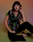 Alex is wearing Pantry Button-Up in Rainbow Magic Waters