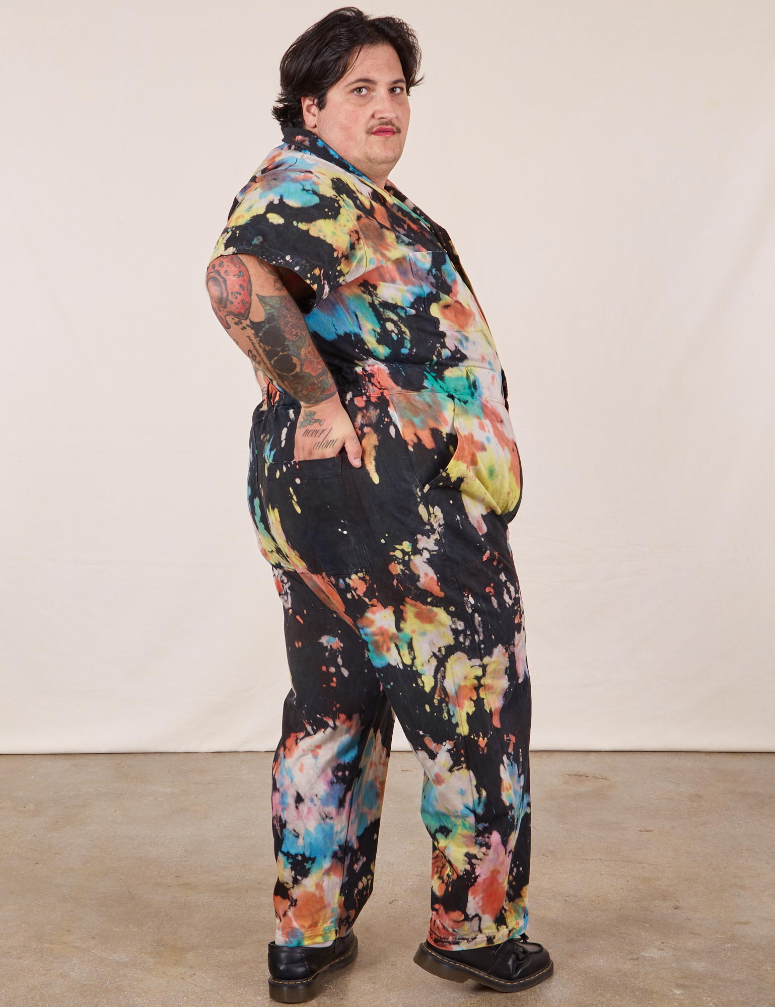 Side view of Short Sleeve Jumpsuit in Rainbow Magic Waters worn by Sam