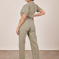 Angled back view of Short Sleeve Jumpsuit in Khaki Grey worn by Tiara