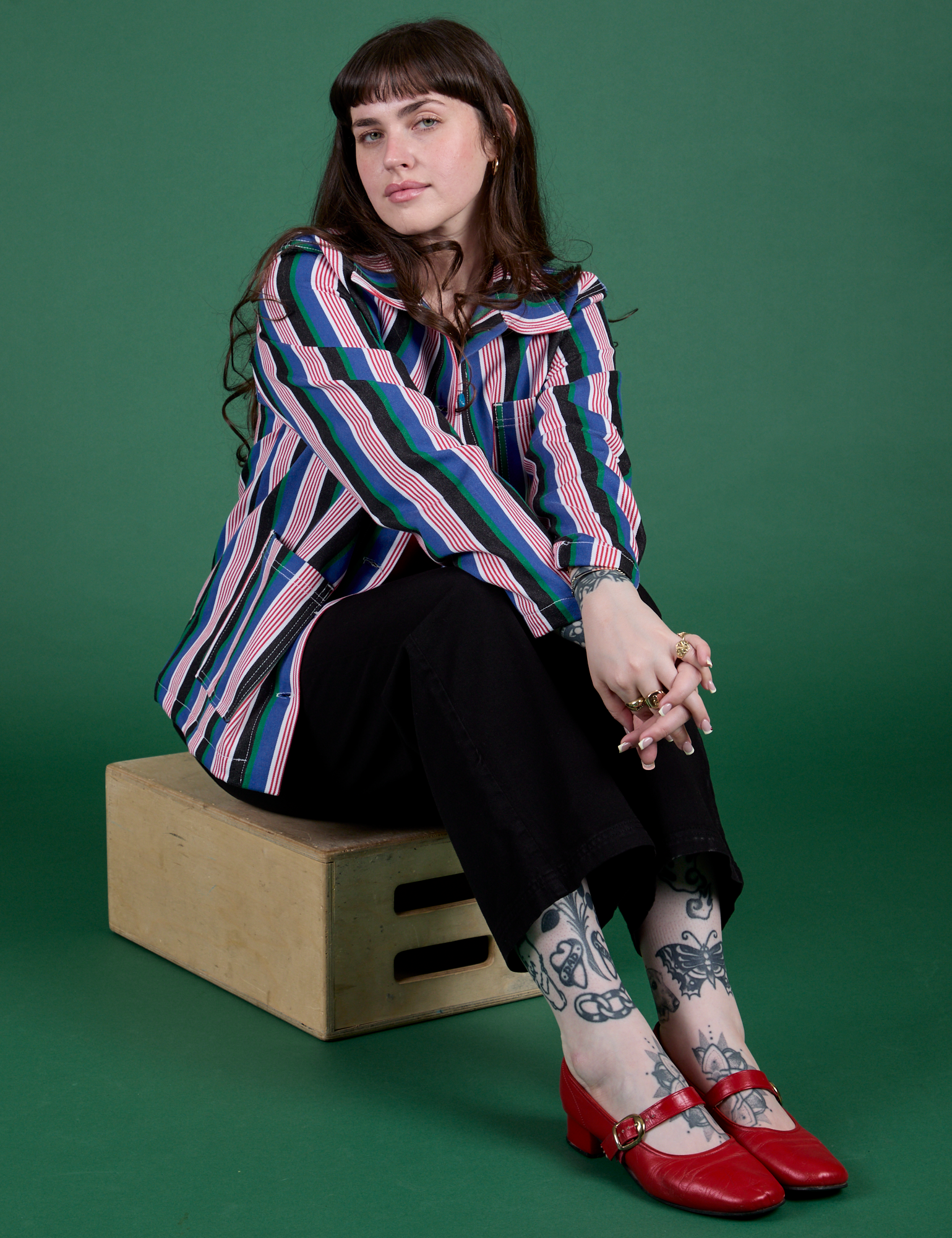 Sydney is wearing  Stripe Work Jacket in Pacific Stripe and Work Pants in black