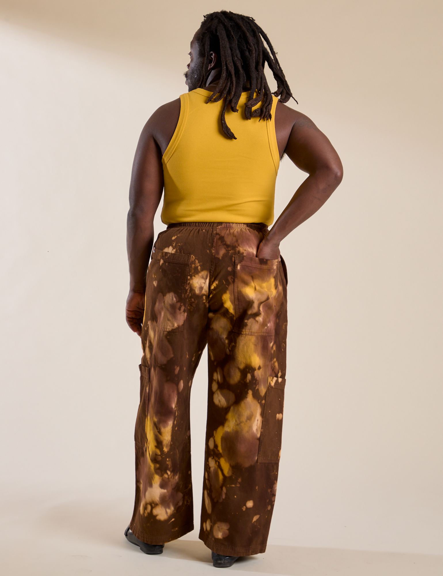 Back view of Magic Waters Drop Pocket Pants in Honey Brown and mustard yellow Cropped Tank on Demi