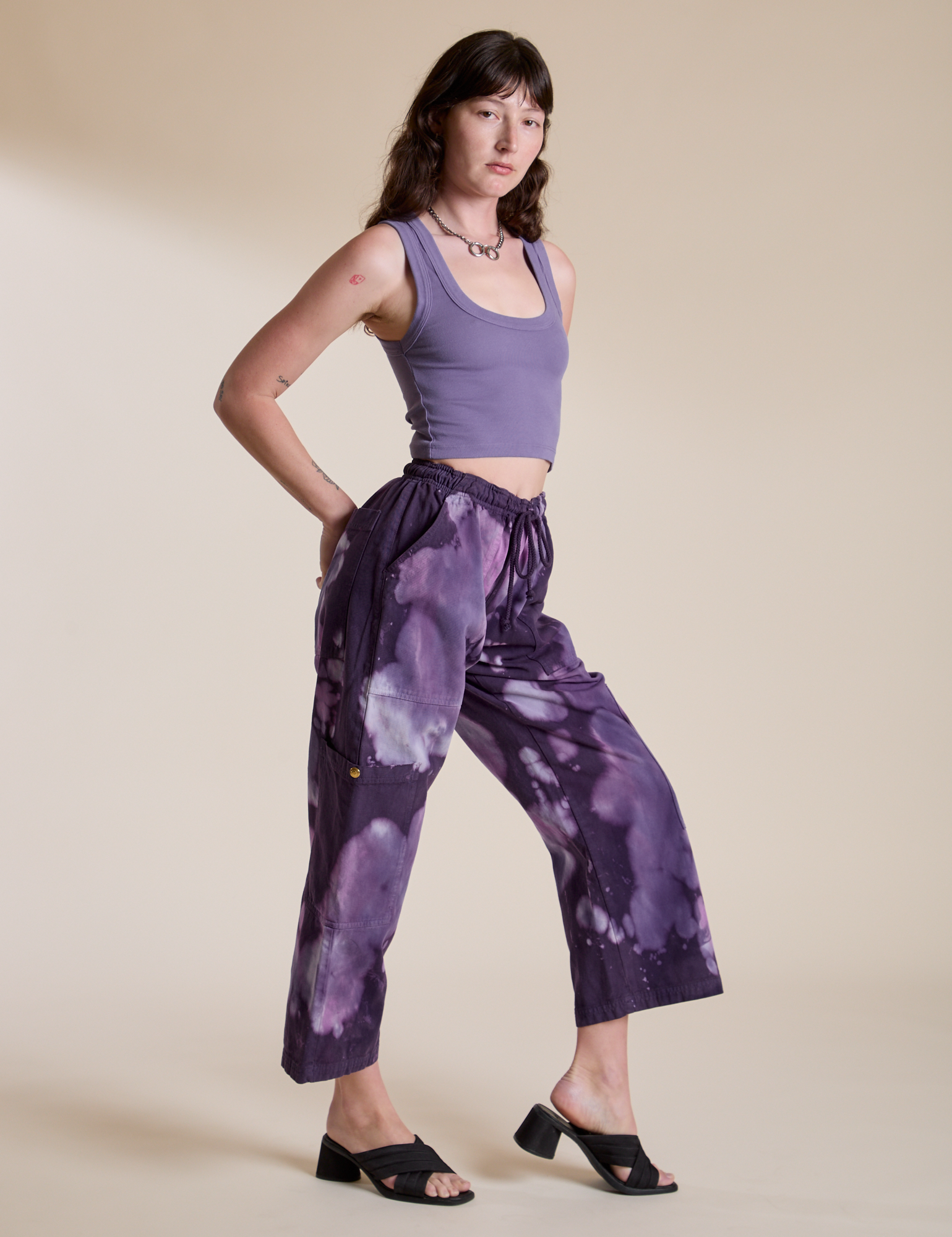 Side view of Magic Waters Drop Pocket Pants in Dark Lavender and faded grape Cropped Tank on Alex