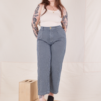 Sydney is wearing Denim Trouser Jeans in Railroad Stripe and a vintage off-white Tank Top