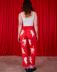 Airbrush Cupid Work Pants back view on Alex