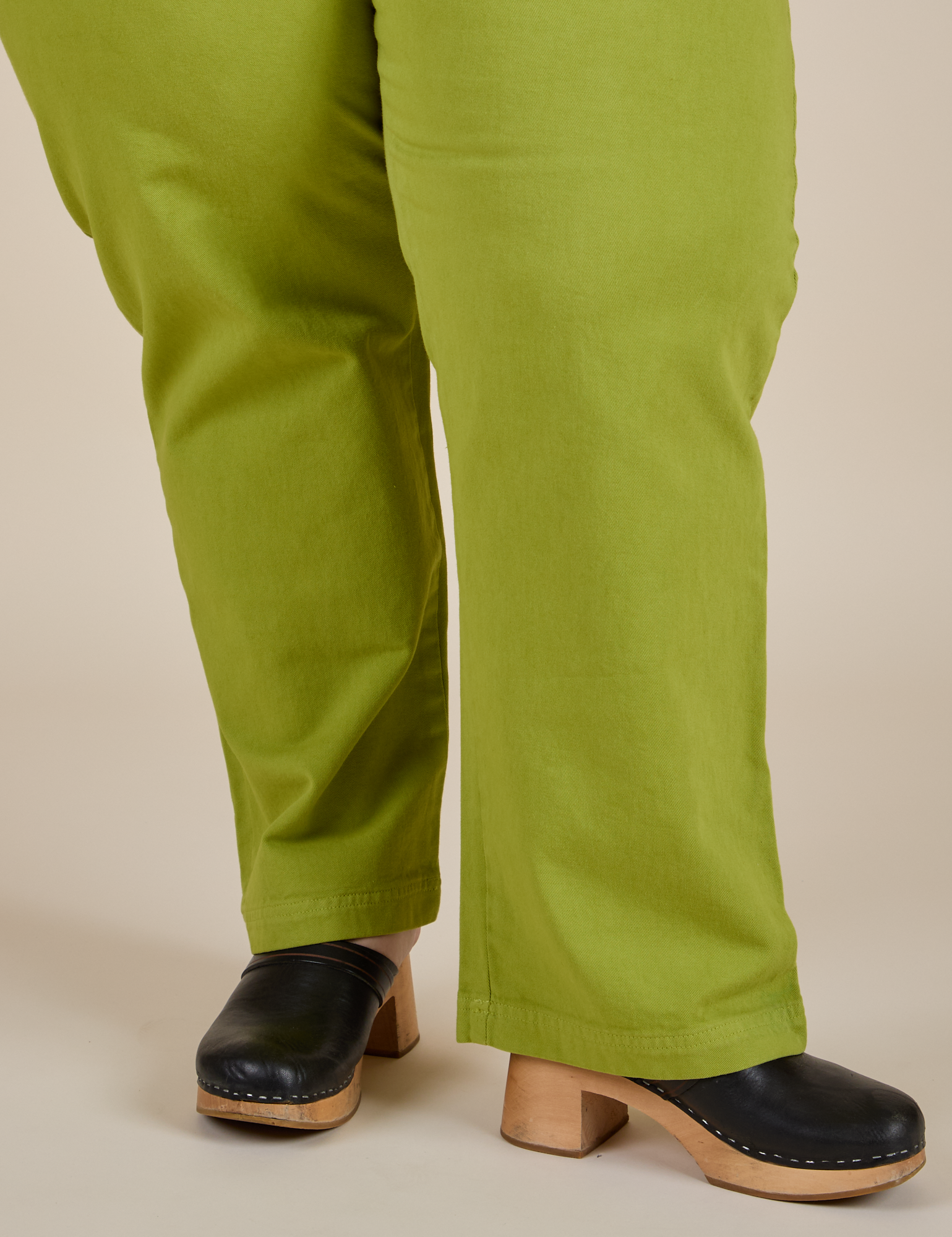 Work Pants in Gross Green pant leg close up on Ashley