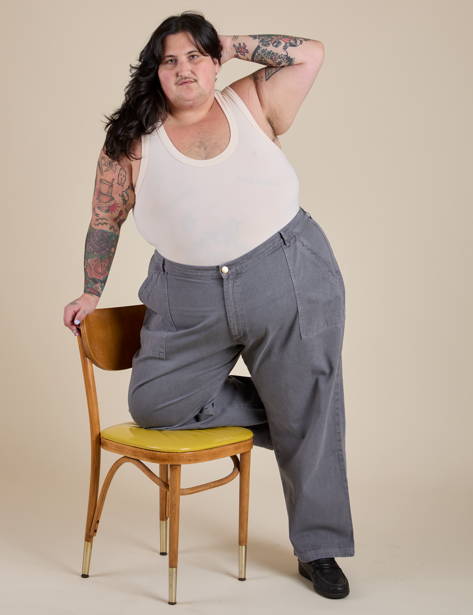 Work Pants in Washed Grey and Tank Top in Vintage Tee Off-White worn by Sam