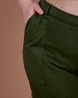 Close up of Ashley's hand in the front pocket of Classic Work Shorts in Evergreen