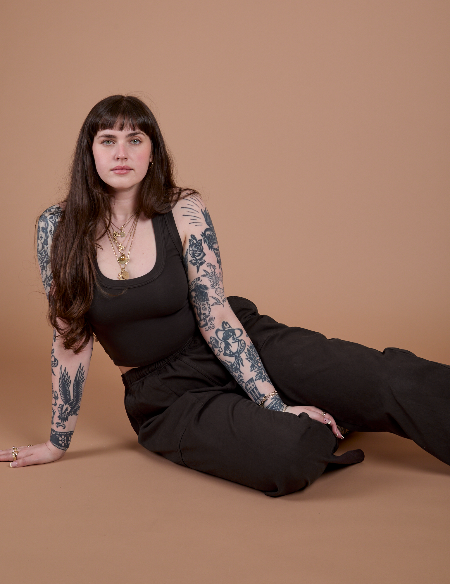 Sydney is wearing Action Pants in Espresso Brown and matching Cropped Tank