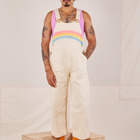 Jesse is wearing Rainbow Overalls and bubblegum pink Cropped Tank Top underneath