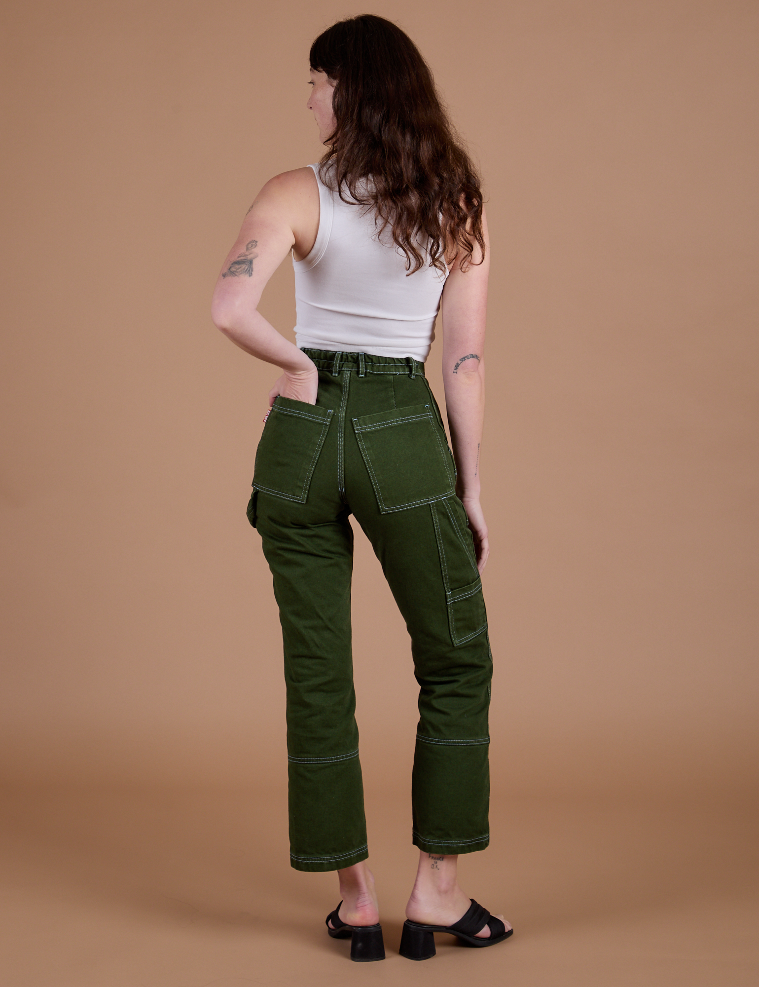 Carpenter Jeans in Evergreen back view on Alex