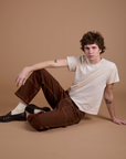 Carpenter Jeans in Fudgesicle Brown and the Organic Vintage Tee in Vintage Tee Off-White on Quinn