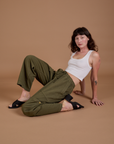 Alex is wearing Drop Pocket Cargo Pants in Surplus Green and Cropped Tank in Vintage Tee White
