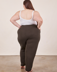 Back view of Cropped Rolled Cuff Sweatpants in Espresso Brown and vintage off-white Cami on Marielena