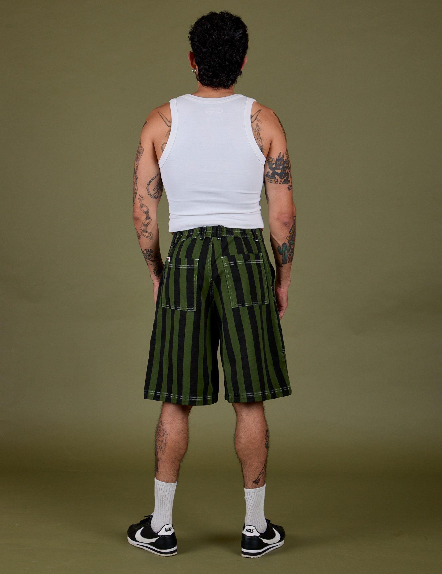 Back view of Longline Work Shorts in Evergreen and Cropped Tank in Vintage Tee White on Jesse