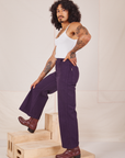 Side view of Bell Bottoms in Nebula Purple and vintage off-white Cami worn by Jesse
